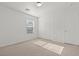 Bright bedroom with neutral carpet, closet, and window at 2624 Courlan Dr, North Las Vegas, NV 89084