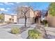 Well-maintained two-story home with a two-car garage and desert landscaping at 2624 Courlan Dr, North Las Vegas, NV 89084