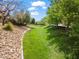 Scenic view of lush greenbelt and mature trees, adjacent to the property at 2624 Courlan Dr, North Las Vegas, NV 89084