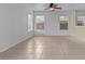 Living room with neutral walls and tile flooring throughout the space at 2624 Courlan Dr, North Las Vegas, NV 89084