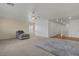 Open living space featuring plush carpeting and a large window for natural light and comfort at 2624 Courlan Dr, North Las Vegas, NV 89084
