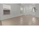 Open-concept living room with tiled floor and neutral walls at 2624 Courlan Dr, North Las Vegas, NV 89084