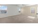 Spacious main bedroom with three windows and neutral carpet at 2624 Courlan Dr, North Las Vegas, NV 89084