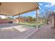 Spacious covered patio features beautiful pavers and leads to a well-maintained backyard at 2624 Courlan Dr, North Las Vegas, NV 89084