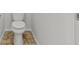 Close-up of a toilet on a tile floor at 2624 Courlan Dr, North Las Vegas, NV 89084