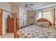 Guest bedroom with a ceiling fan, a neutral wall color, and tile floors at 2735 Poppyseed Way, Las Vegas, NV 89142