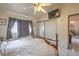 Bedroom with a ceiling fan, neutral walls, and sliding closet doors at 2735 Poppyseed Way, Las Vegas, NV 89142