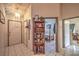 Entryway featuring neutral tile flooring, a coat closet, and views into the bedroom and main living area at 2735 Poppyseed Way, Las Vegas, NV 89142