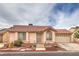 Charming single-story home featuring a red tile roof and a well-maintained, low-water landscaping design at 2735 Poppyseed Way, Las Vegas, NV 89142