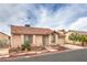 A single story home featuring a red tile roof, security bars on the windows and mature landscaping at 2735 Poppyseed Way, Las Vegas, NV 89142