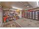 Spacious garage with shelving, cabinets, work bench, and ample storage space, ready for projects and organization at 2735 Poppyseed Way, Las Vegas, NV 89142