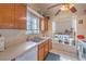 Functional kitchen featuring tile floors, a double basin sink, and lots of natural light at 2735 Poppyseed Way, Las Vegas, NV 89142