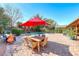 Spacious backyard featuring a pool, patio dining set, and mature landscaping at 2809 Gilmary Ave, Las Vegas, NV 89102