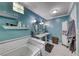 Stylish bathroom featuring double vanities, a soaking tub, and modern fixtures, creating a spa-like experience at 2809 Gilmary Ave, Las Vegas, NV 89102