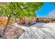 Well maintained single-story home with a stone and brick facade featuring a concrete driveway and stone landscaping at 2809 Gilmary Ave, Las Vegas, NV 89102