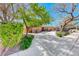 Charming single-story home featuring a well-manicured lawn and lengthy concrete driveway at 2809 Gilmary Ave, Las Vegas, NV 89102