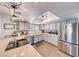 Bright kitchen with stainless steel appliances, breakfast bar, and stylish pendant lighting at 2809 Gilmary Ave, Las Vegas, NV 89102