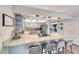 Stylish kitchen with quartz countertops, stainless steel appliances, and breakfast bar seating at 2809 Gilmary Ave, Las Vegas, NV 89102