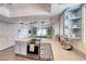 Open kitchen layout with stainless steel appliances, breakfast bar, and stylish pendant lighting at 2809 Gilmary Ave, Las Vegas, NV 89102