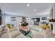 Open-concept living room showcasing a large sectional, fireplace, and entertainment area, ideal for Gathering gatherings and movie nights at 2809 Gilmary Ave, Las Vegas, NV 89102