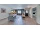 Cozy living room featuring tile floors, neutral decor, and seamless flow into other spaces at 2809 Gilmary Ave, Las Vegas, NV 89102