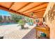 Inviting outdoor patio with ceiling fan, comfortable seating, and poolside view at 2809 Gilmary Ave, Las Vegas, NV 89102