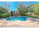 Backyard featuring an inviting kidney-shaped pool, mature landscaping, and spacious patio at 2809 Gilmary Ave, Las Vegas, NV 89102