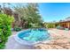 Backyard with a sparkling pool, mature trees, and inviting outdoor space at 2809 Gilmary Ave, Las Vegas, NV 89102