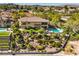A backyard oasis in a desert backyard, including a pool, landscaping, and patio at 2994 San Lorenzo Ct, Henderson, NV 89052