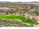 Scenic view of a lush green golf course nestled within a community of elegant homes and desert landscape at 2994 San Lorenzo Ct, Henderson, NV 89052