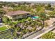 A large backyard with unique terraced desert landscaping, pool, and outdoor patio at 2994 San Lorenzo Ct, Henderson, NV 89052