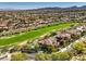Expansive golf course view with lush landscaping and a private pool, offering a luxurious lifestyle at 2994 San Lorenzo Ct, Henderson, NV 89052