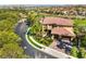 Aerial view of a luxurious home and lush landscaping located in a gated community at 2994 San Lorenzo Ct, Henderson, NV 89052