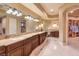 Vanity area with double sinks, granite countertops, and a large mirror at 2994 San Lorenzo Ct, Henderson, NV 89052