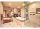 This primary bath showcases a soaking tub, a fireplace and a seamless glass enclosed shower at 2994 San Lorenzo Ct, Henderson, NV 89052