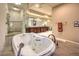This luxurious bathroom features a jetted tub and a separate glass-enclosed shower at 2994 San Lorenzo Ct, Henderson, NV 89052