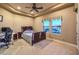 Comfortable bedroom featuring a queen-size bed, ceiling fan, and views from the window at 2994 San Lorenzo Ct, Henderson, NV 89052