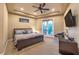 Well-appointed bedroom with a comfortable bed, ceiling fan, and balcony access at 2994 San Lorenzo Ct, Henderson, NV 89052