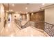 Spacious hallway with wrought iron railings, marble floors, and recessed lighting at 2994 San Lorenzo Ct, Henderson, NV 89052