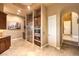 Modern kitchen with stainless steel appliances, granite countertops, custom cabinetry, and ample space for culinary adventures at 2994 San Lorenzo Ct, Henderson, NV 89052