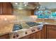 The kitchen area displays stainless steel appliances and granite countertops at 2994 San Lorenzo Ct, Henderson, NV 89052
