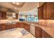 An expansive kitchen layout showcases stainless steel appliances, ample countertop space, and seamless flow to the living area at 2994 San Lorenzo Ct, Henderson, NV 89052