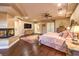 Spacious primary bedroom featuring hardwood floors, fireplace and ample natural light at 2994 San Lorenzo Ct, Henderson, NV 89052