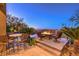 Backyard patio with a pool, fire table, and comfortable seating, offering a perfect setting for relaxation and entertainment at 2994 San Lorenzo Ct, Henderson, NV 89052