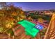 Inviting backyard pool and spa at night with lounge chairs and city views, perfect for relaxation and entertainment at 2994 San Lorenzo Ct, Henderson, NV 89052
