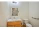 Bathroom with single vanity, tile countertops, and a toilet, offering a clean and functional space at 3101 Margarita St, Pahrump, NV 89048