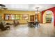 Inviting dining room with comfortable seating, large windows, and an open layout to the kitchen area at 3101 Margarita St, Pahrump, NV 89048
