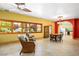 Well-lit dining area with cozy chairs, large windows, and seamless flow to the kitchen for easy entertaining at 3101 Margarita St, Pahrump, NV 89048