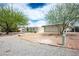 Charming front exterior with mature landscaping and a circular driveway at 3101 Margarita St, Pahrump, NV 89048
