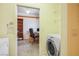 Bright laundry room and adjacent bonus room, complete with appliances and storage at 3101 Margarita St, Pahrump, NV 89048